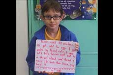 A student sharing her written example of writing mathematical problems linked to real life situations