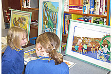 lit-fest3.jpg Some younger students deep in discussion about original illustrator artwork – Literacy Festival 2014